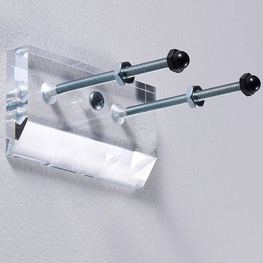 Clear acrylic wall hanger with threaded bolts for mounting a skateboard deck
